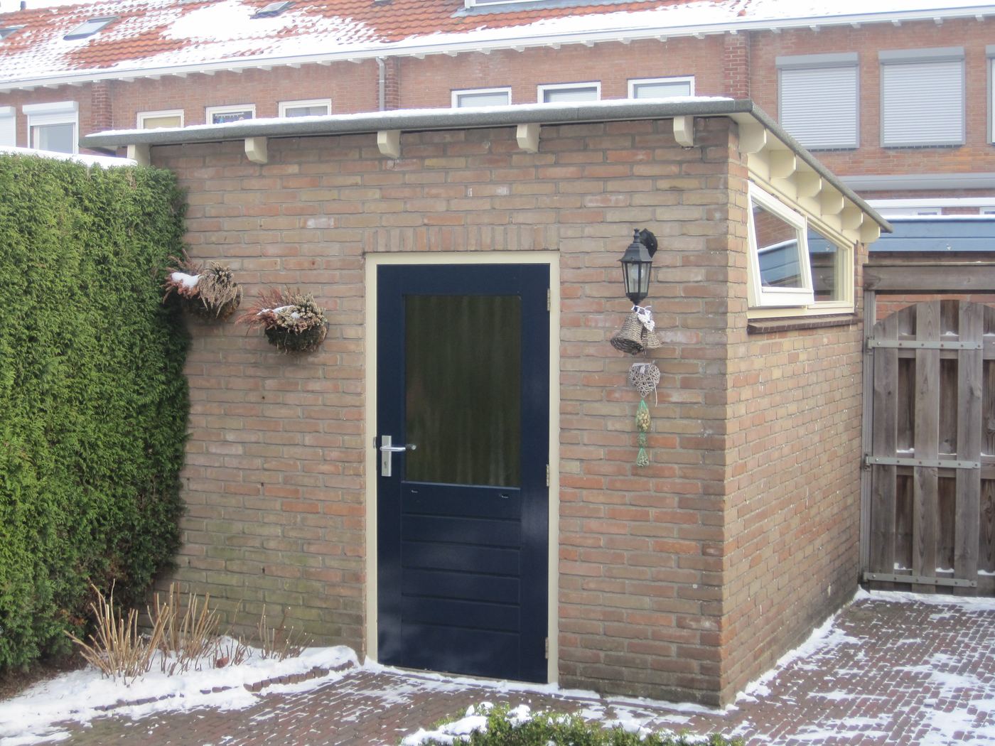 Uitbreiding schuur met overkapping