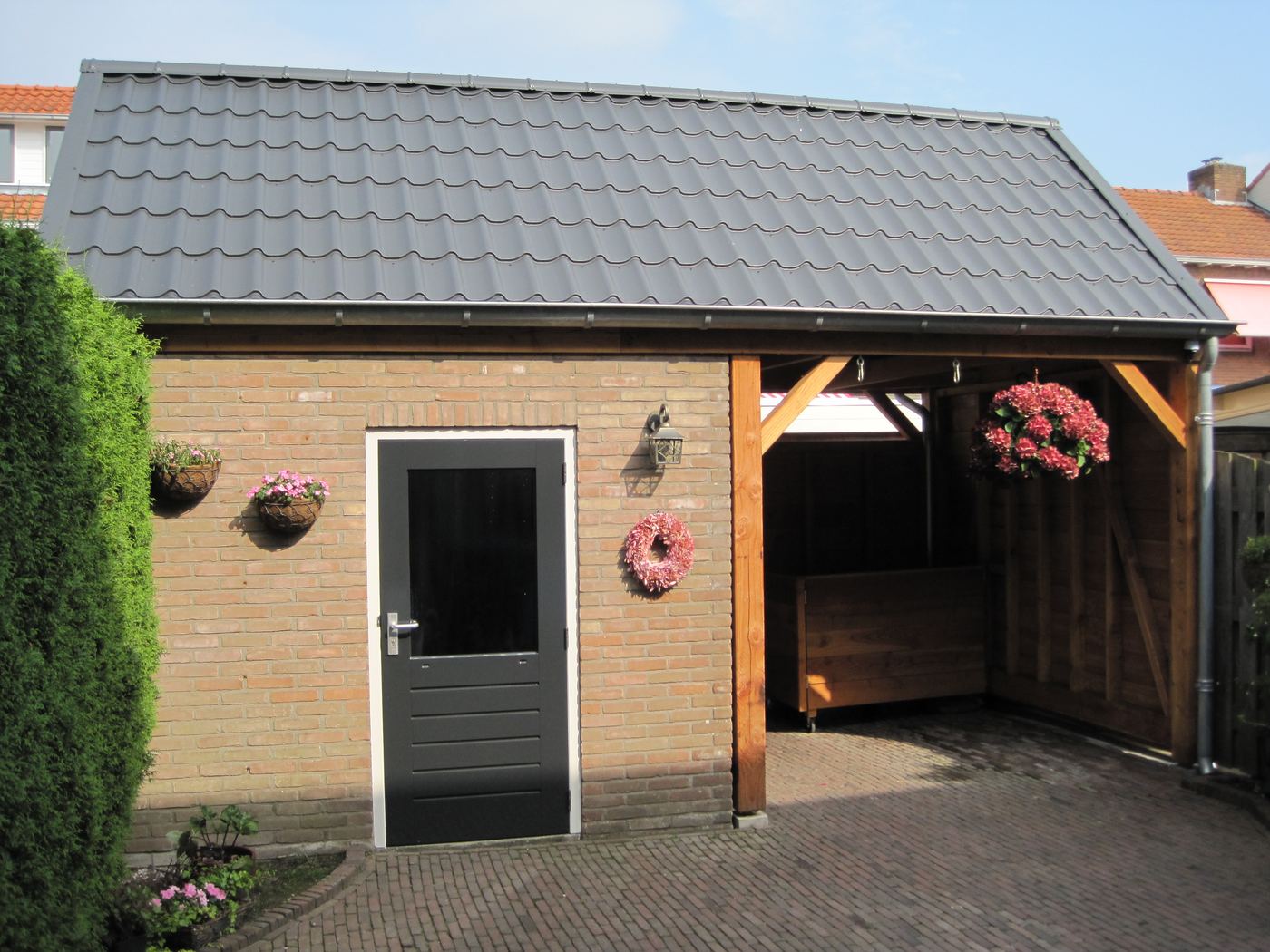 Uitbreiding schuur met overkapping